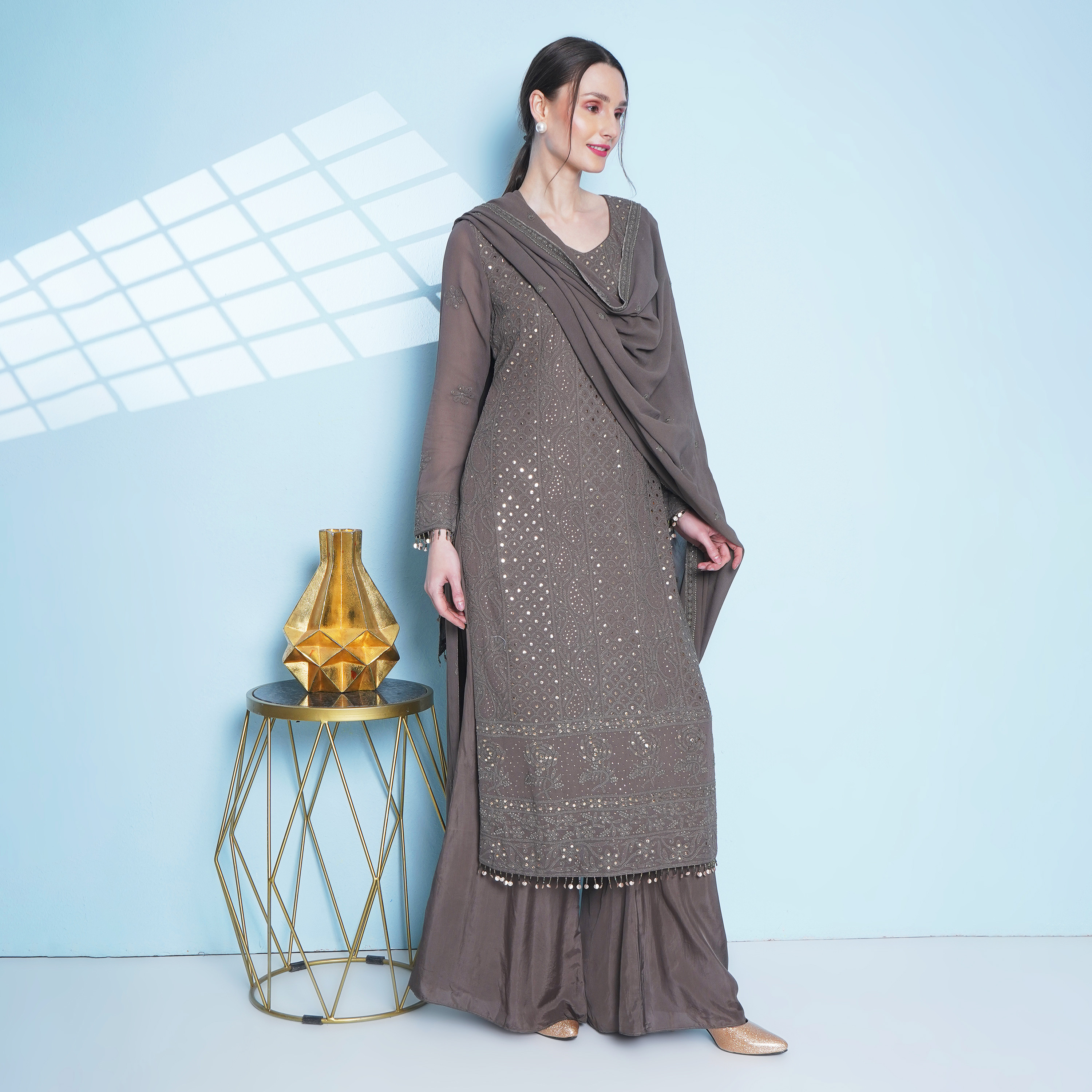 Olive georgette chikankari hand embroided long tunic and dupatta,  worn with flared trousers.