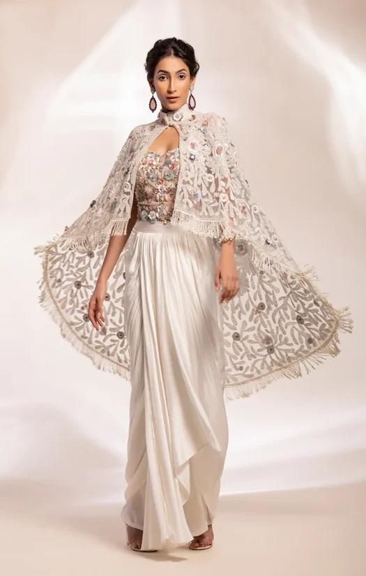 Embroidered cape worn with corset and wrap lungi drape skirt